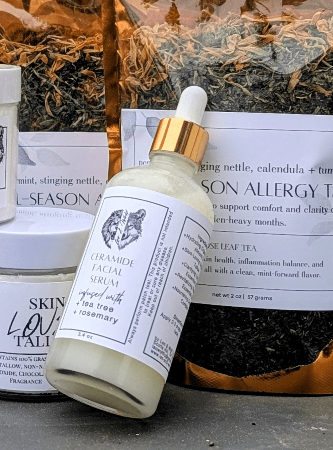 Collection of natural skincare products and tea bags on a surface outdoors.