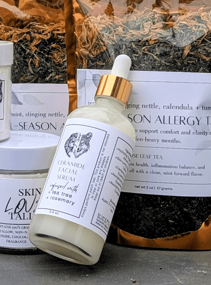 Collection of natural skincare products and tea bags on a surface outdoors.